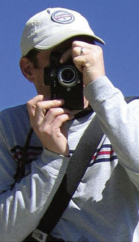 Partial Photo of Web Site and Book Designer with Camera