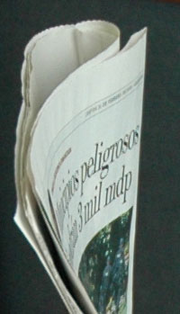 Partial Photo of Man Holding Paper with Sala de Prensa Written on it